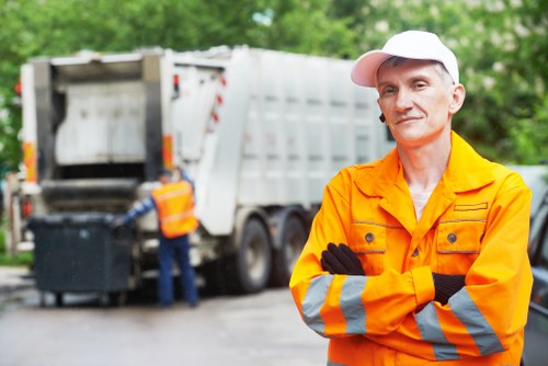 Garbage collection team handling waste removal in a London residential street