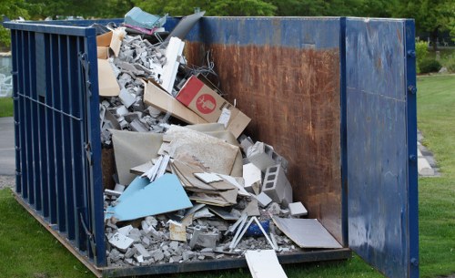 Bulk waste collection team handling bulky household items in a London residential street