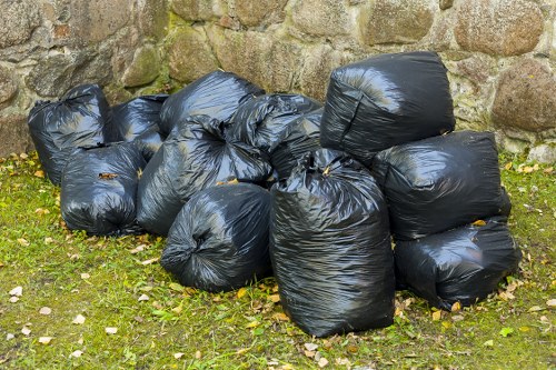 Professional collection of litter and waste in a London communal area